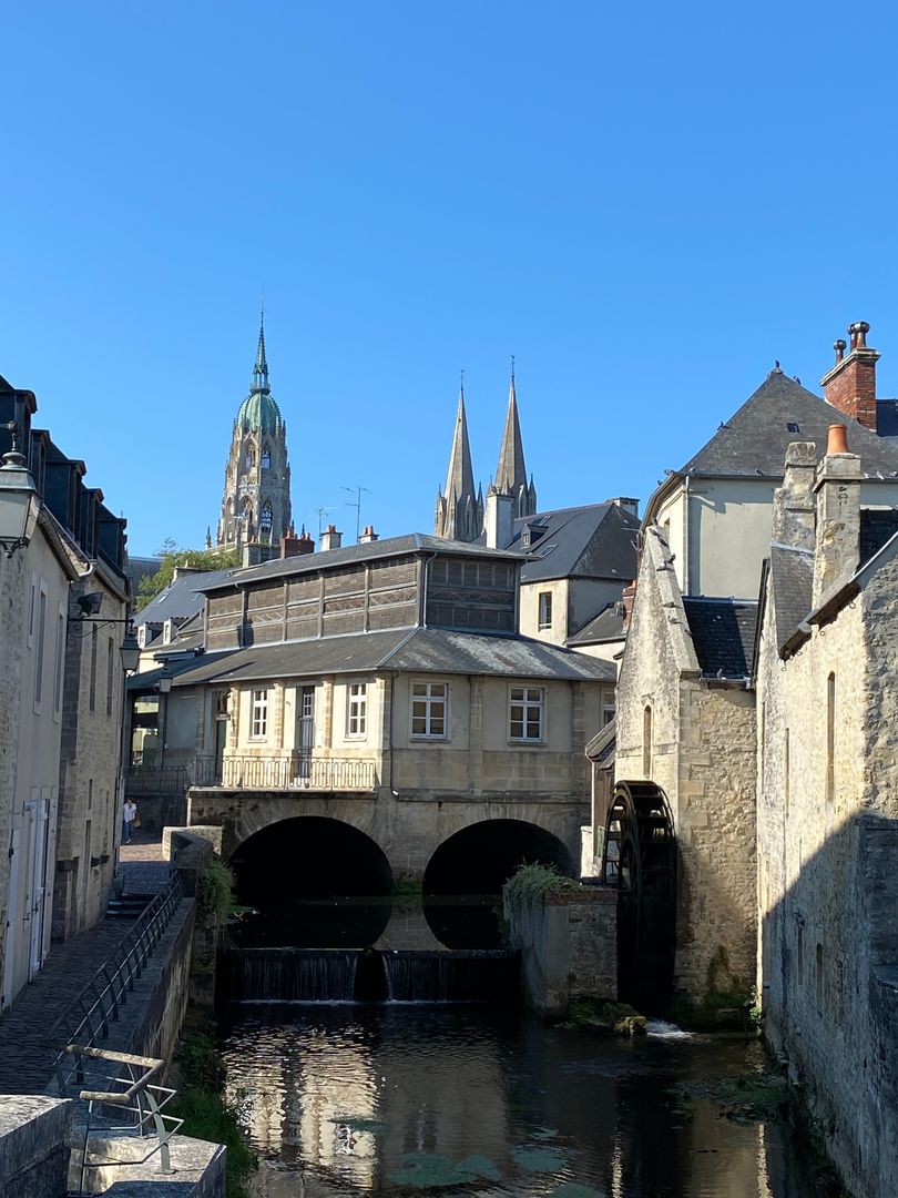 A city with a river and a church in the background.