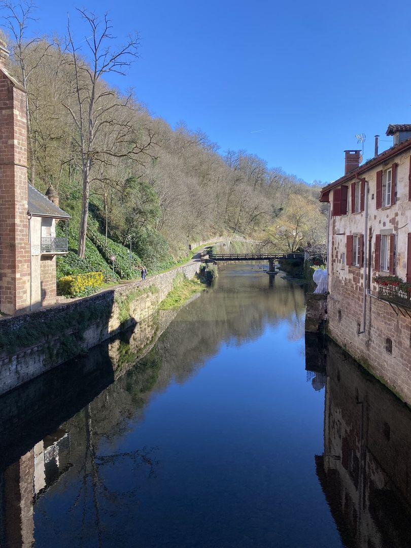 A river runs through a small town in france.