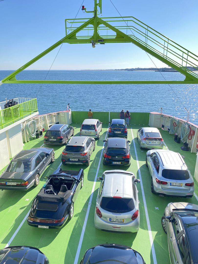 Cars parked on the deck of a ferry.