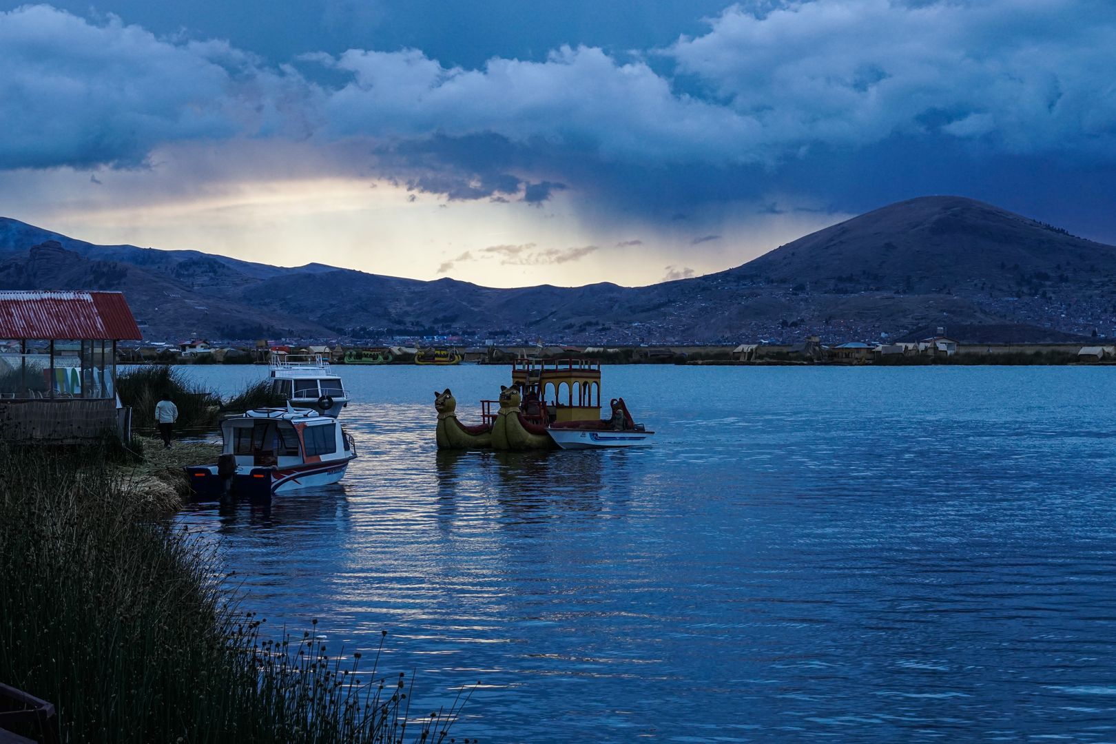 A lake with a boat docked in it.
